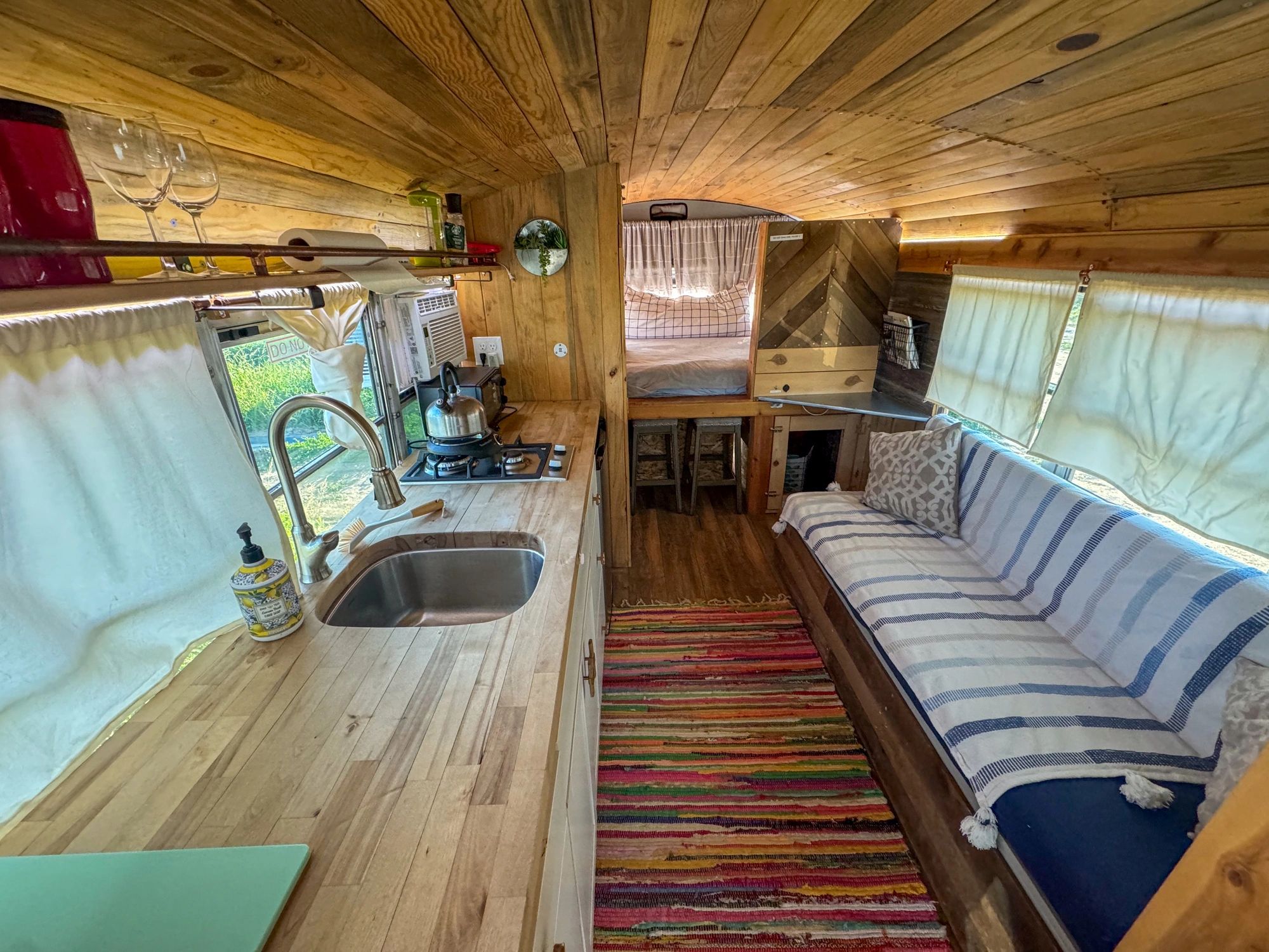 Compact custom tiny home interior with handcrafted finishes
